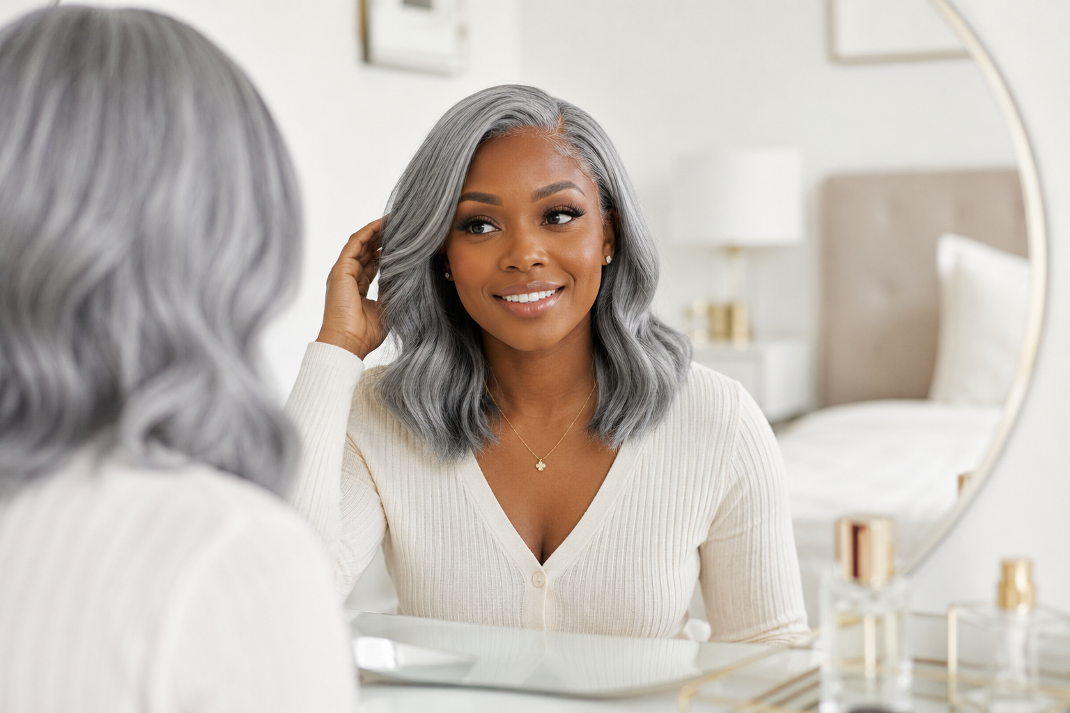 Black woman wearing a natural-looking silver gray lace front human hair wig